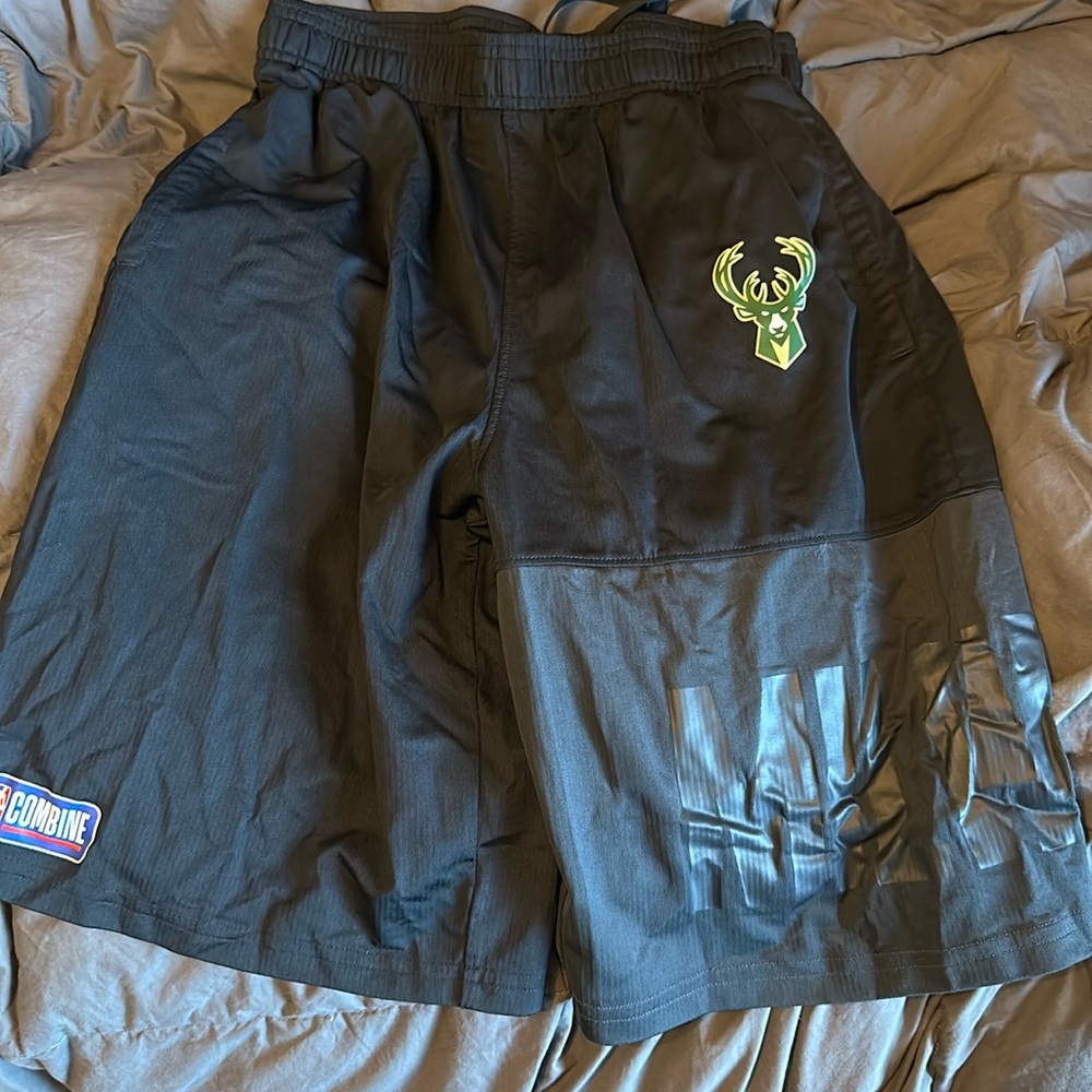 Under Armour youth extra large, Milwaukee Bucks basketball shorts. Black